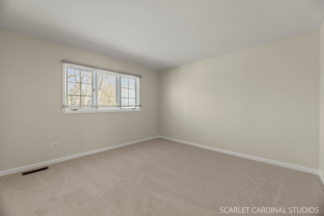 unfurnished room with carpet flooring