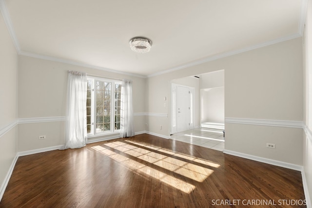 unfurnished room featuring hardwood / wood-style flooring and crown molding