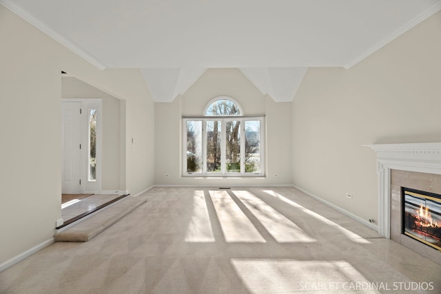 unfurnished living room with crown molding, a fireplace, vaulted ceiling, and light carpet