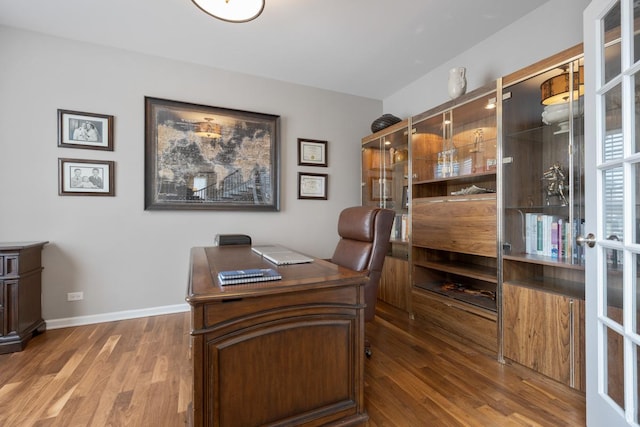 office area featuring french doors and dark hardwood / wood-style floors