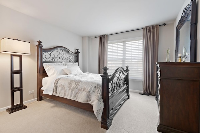 bedroom with light colored carpet