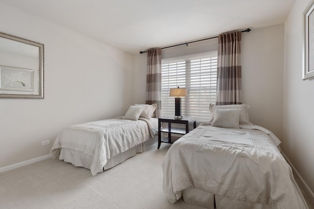 bedroom with light colored carpet