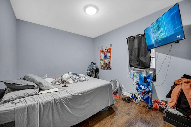 bedroom featuring dark hardwood / wood-style flooring