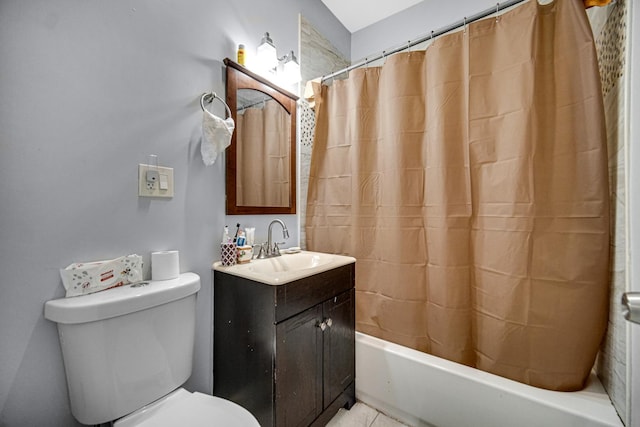 bathroom with tile patterned flooring, vanity, and toilet