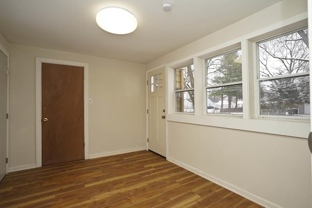 doorway featuring dark hardwood / wood-style floors