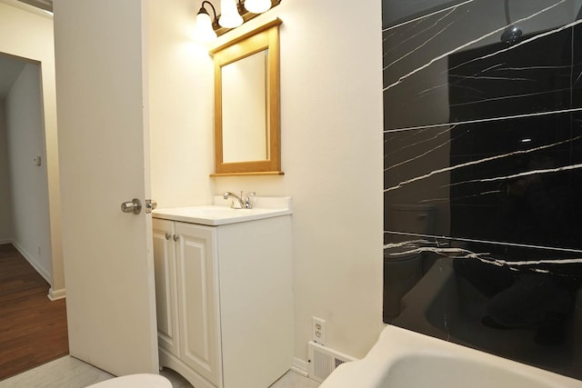 bathroom featuring vanity and wood-type flooring