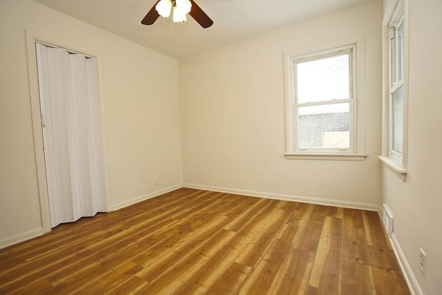 spare room featuring ceiling fan and wood-type flooring