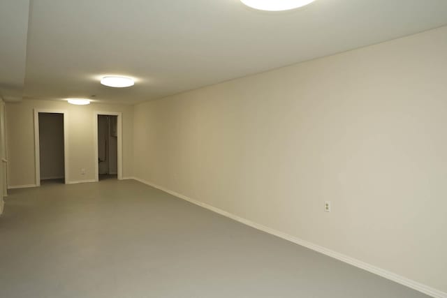 spare room with concrete flooring