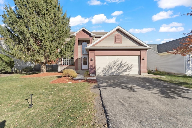 view of front of home featuring a garage and a front yard