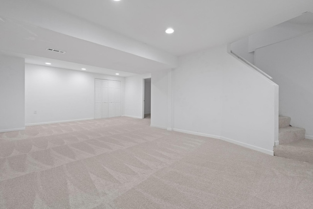 basement with light colored carpet