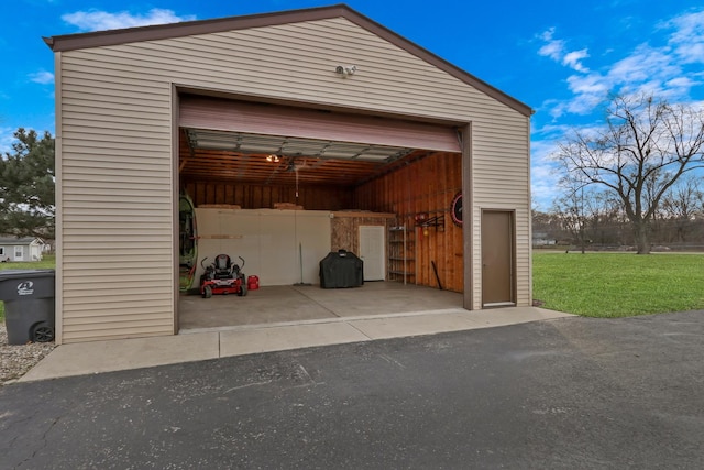 garage featuring a lawn