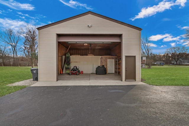 garage featuring a lawn