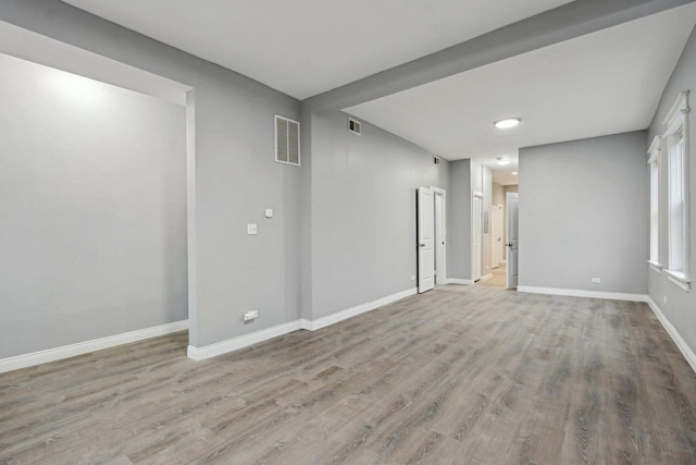 unfurnished room featuring light wood-type flooring