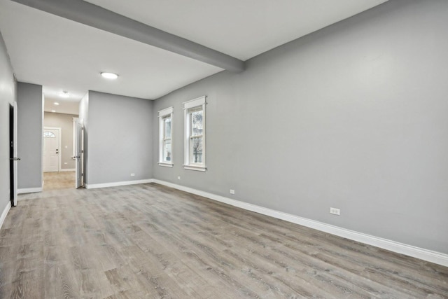 unfurnished room with light hardwood / wood-style flooring