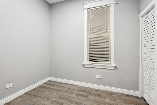 empty room with hardwood / wood-style flooring