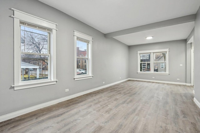 spare room with light hardwood / wood-style flooring