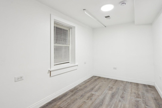 spare room featuring light hardwood / wood-style flooring