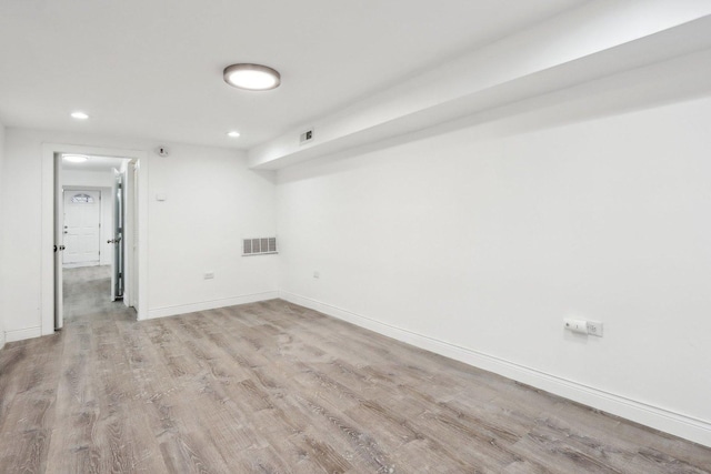 spare room with light wood-type flooring