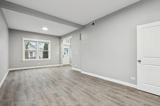 spare room with light wood-type flooring