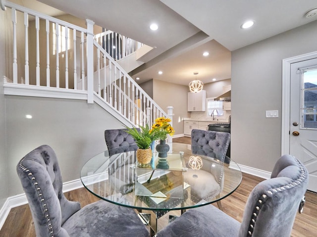 dining room with sink and light hardwood / wood-style floors