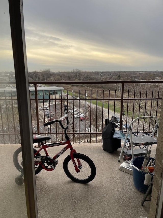 view of balcony at dusk