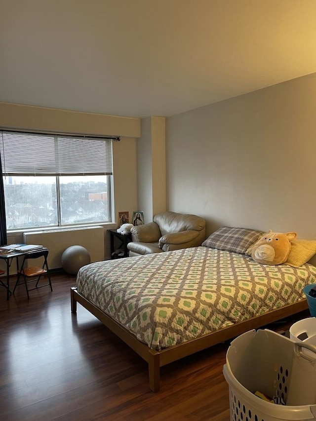 bedroom featuring dark hardwood / wood-style flooring