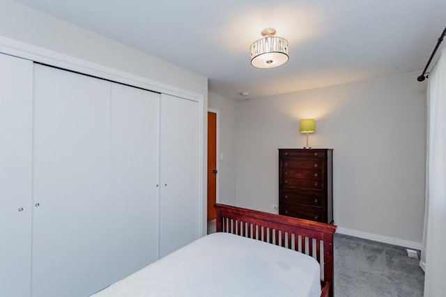 carpeted bedroom with a closet