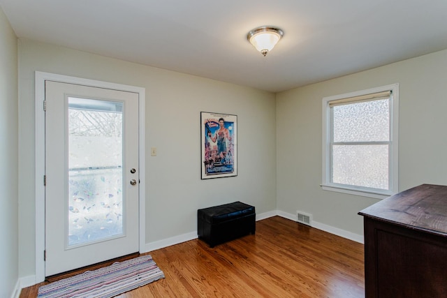 entryway with light hardwood / wood-style floors