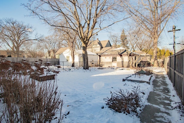 view of yard covered in snow