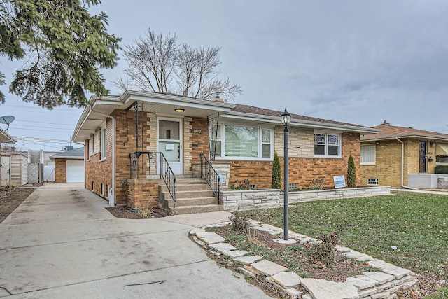 view of front facade with a garage, an outdoor structure, and a front yard