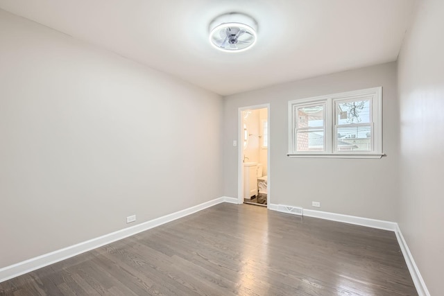 empty room featuring dark hardwood / wood-style floors