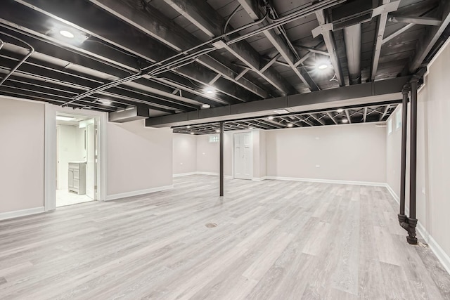 basement featuring wood-type flooring