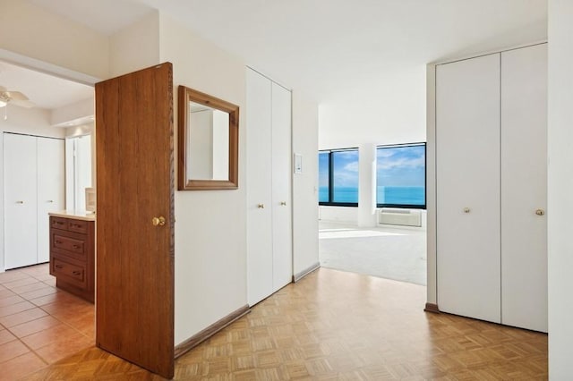 corridor with light parquet flooring