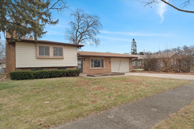 split level home with a front yard and a garage