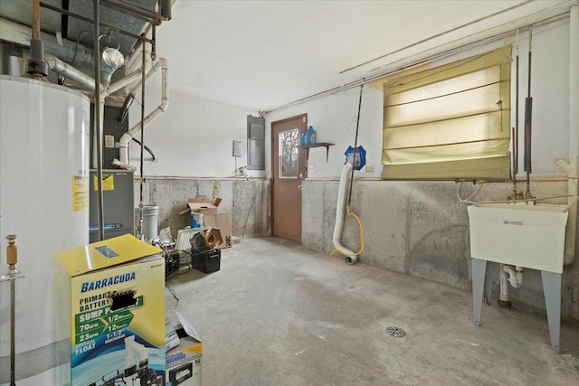 basement featuring water heater and sink