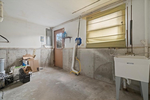 basement with sink and electric panel