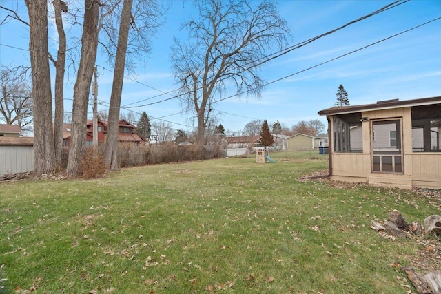 view of yard with a sunroom