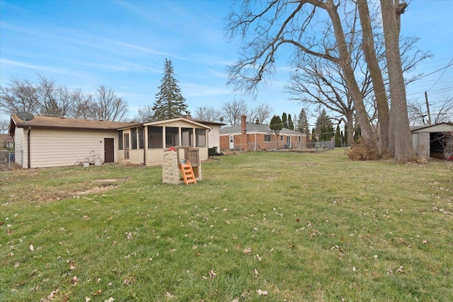 view of yard with a sunroom