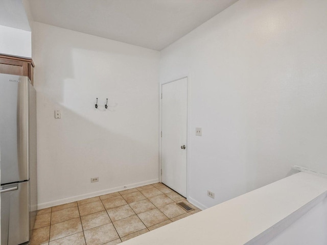 interior space featuring light tile patterned floors