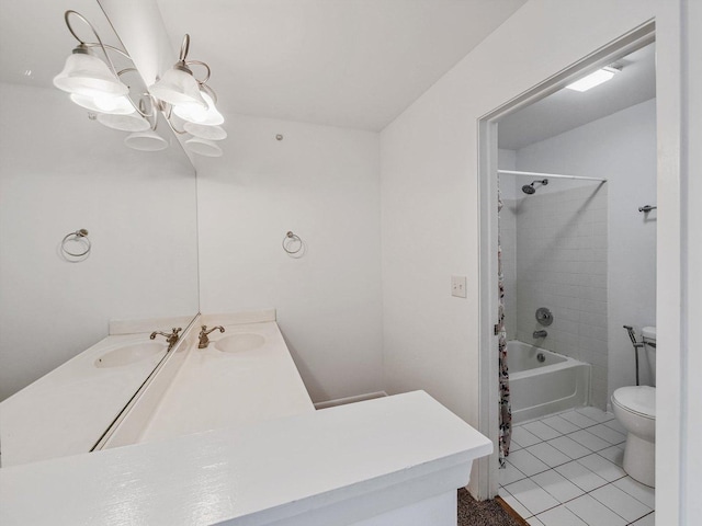 full bathroom featuring vanity, tiled shower / bath combo, a notable chandelier, tile patterned flooring, and toilet