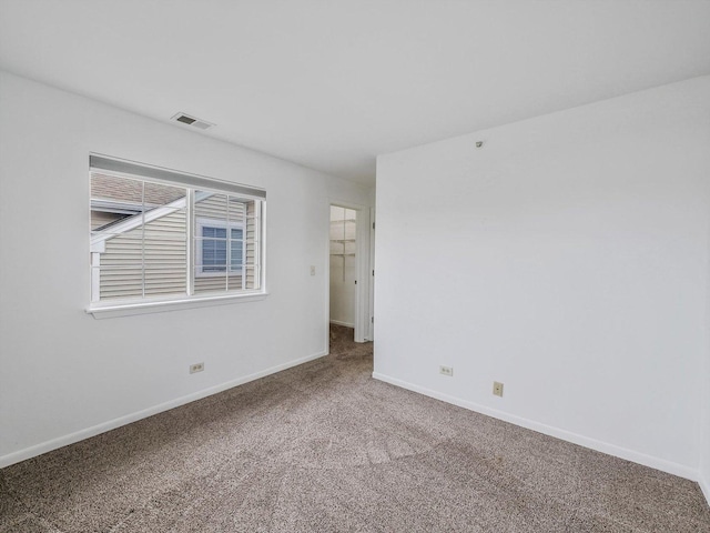 unfurnished room with carpet floors