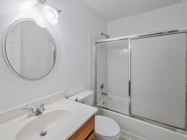 full bathroom with vanity, toilet, and enclosed tub / shower combo