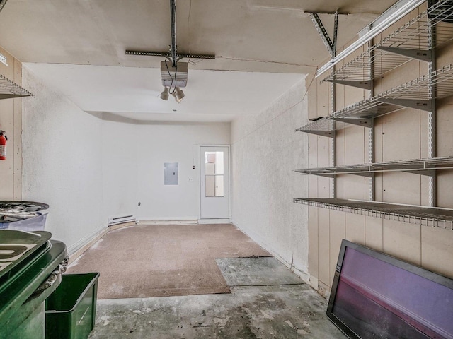 garage with electric panel and a garage door opener