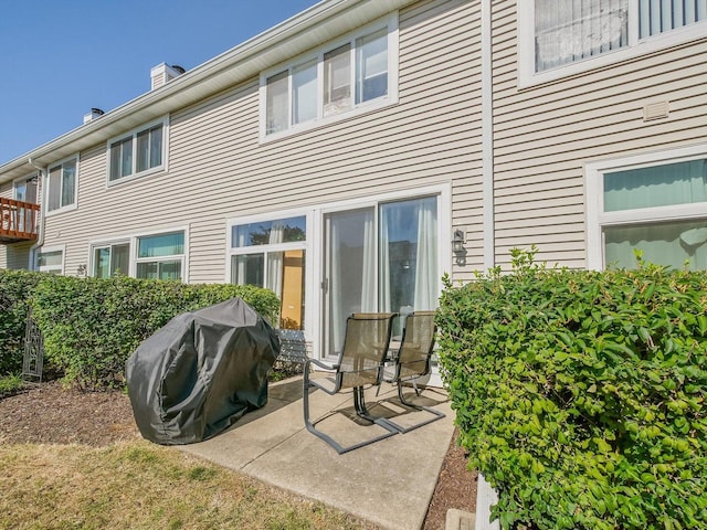 rear view of property featuring a patio area