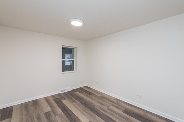 empty room featuring dark hardwood / wood-style floors