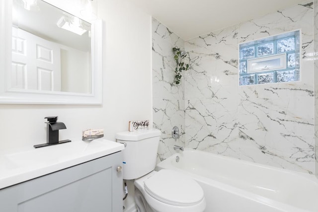 full bathroom with vanity, toilet, and tiled shower / bath