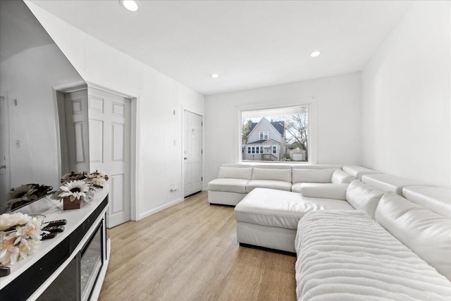 living room with light hardwood / wood-style floors