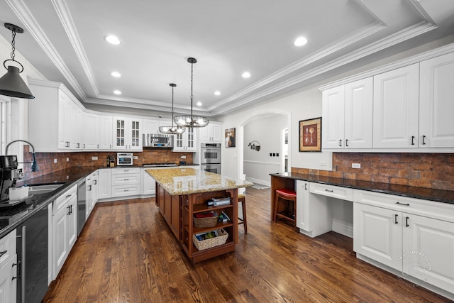 kitchen featuring glass insert cabinets, decorative light fixtures, white cabinetry, and open shelves