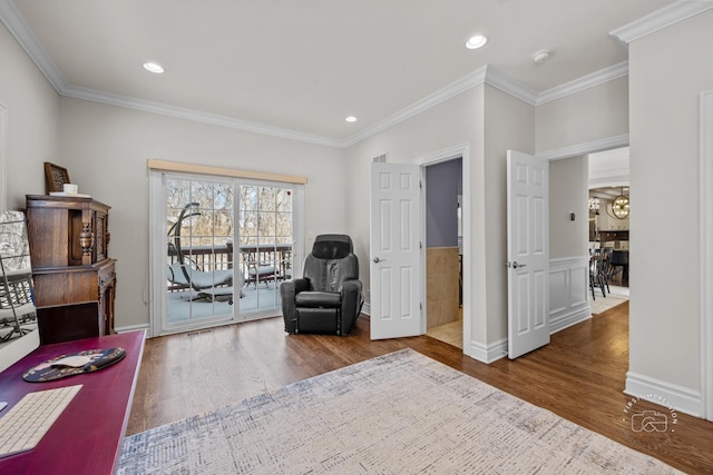 sitting room featuring ornamental molding, wood finished floors, and recessed lighting