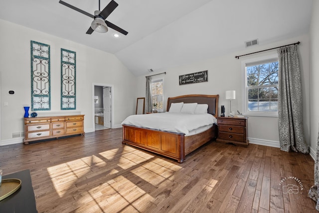 bedroom with lofted ceiling, wood-type flooring, visible vents, a ceiling fan, and baseboards